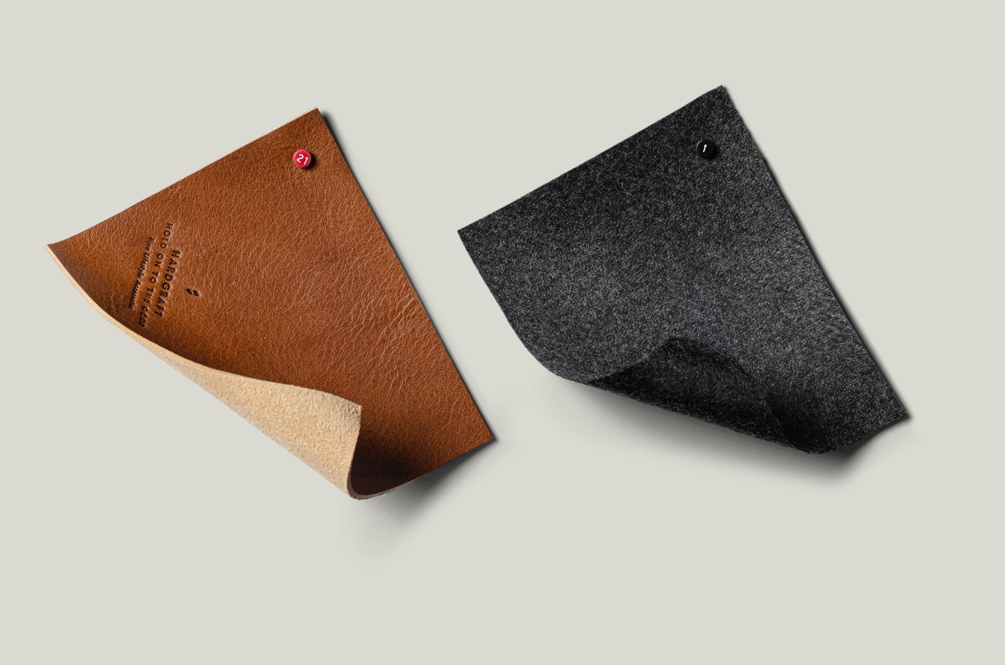 Brown leather and grey wool swatches.