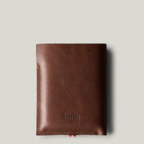 A brown leather iPhone Duo with a pebbled texture, shown vertically against a light gray background.