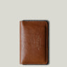 Brown leather wallet on a light gray background