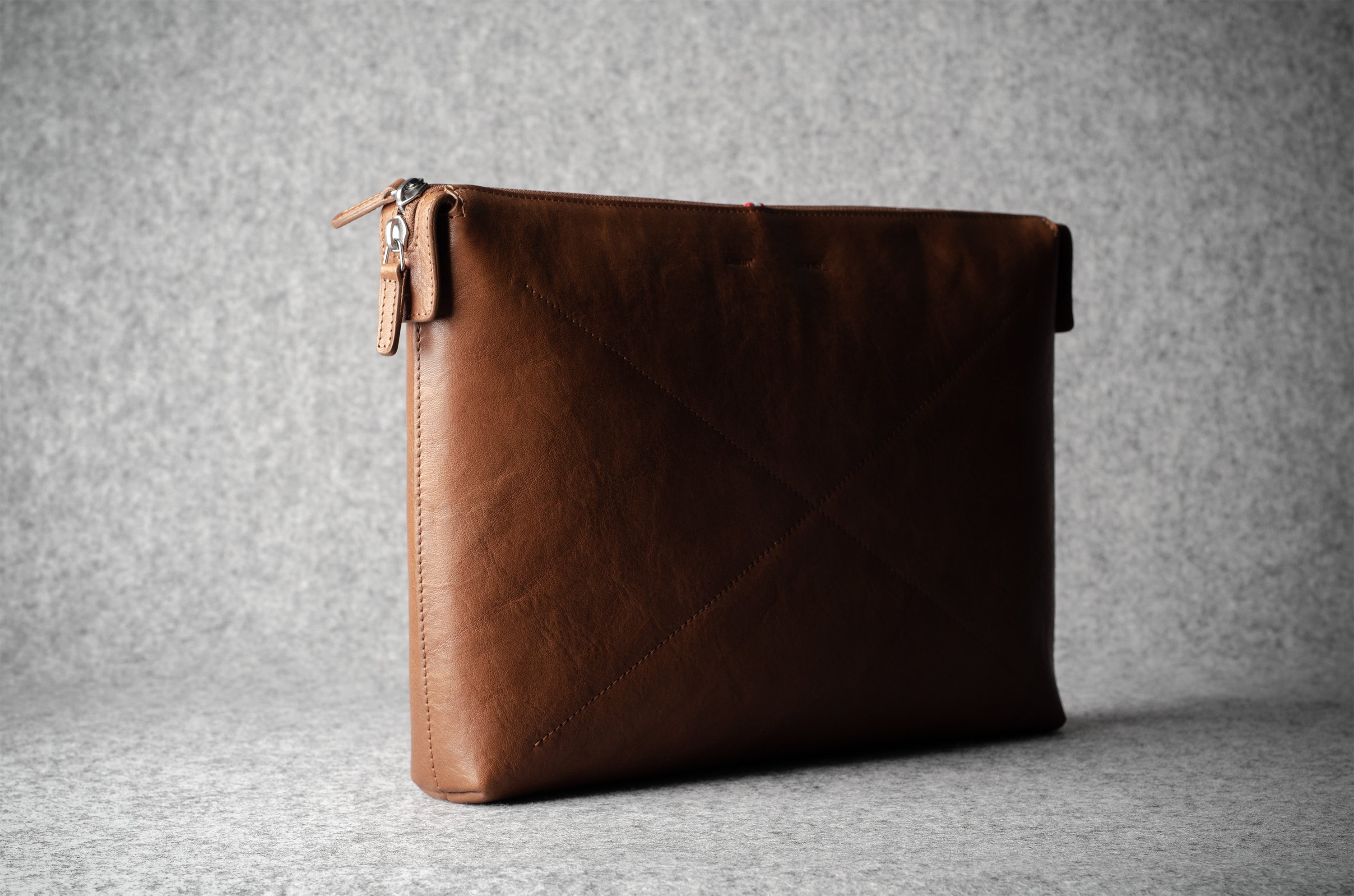 Brown leather laptop case with zip