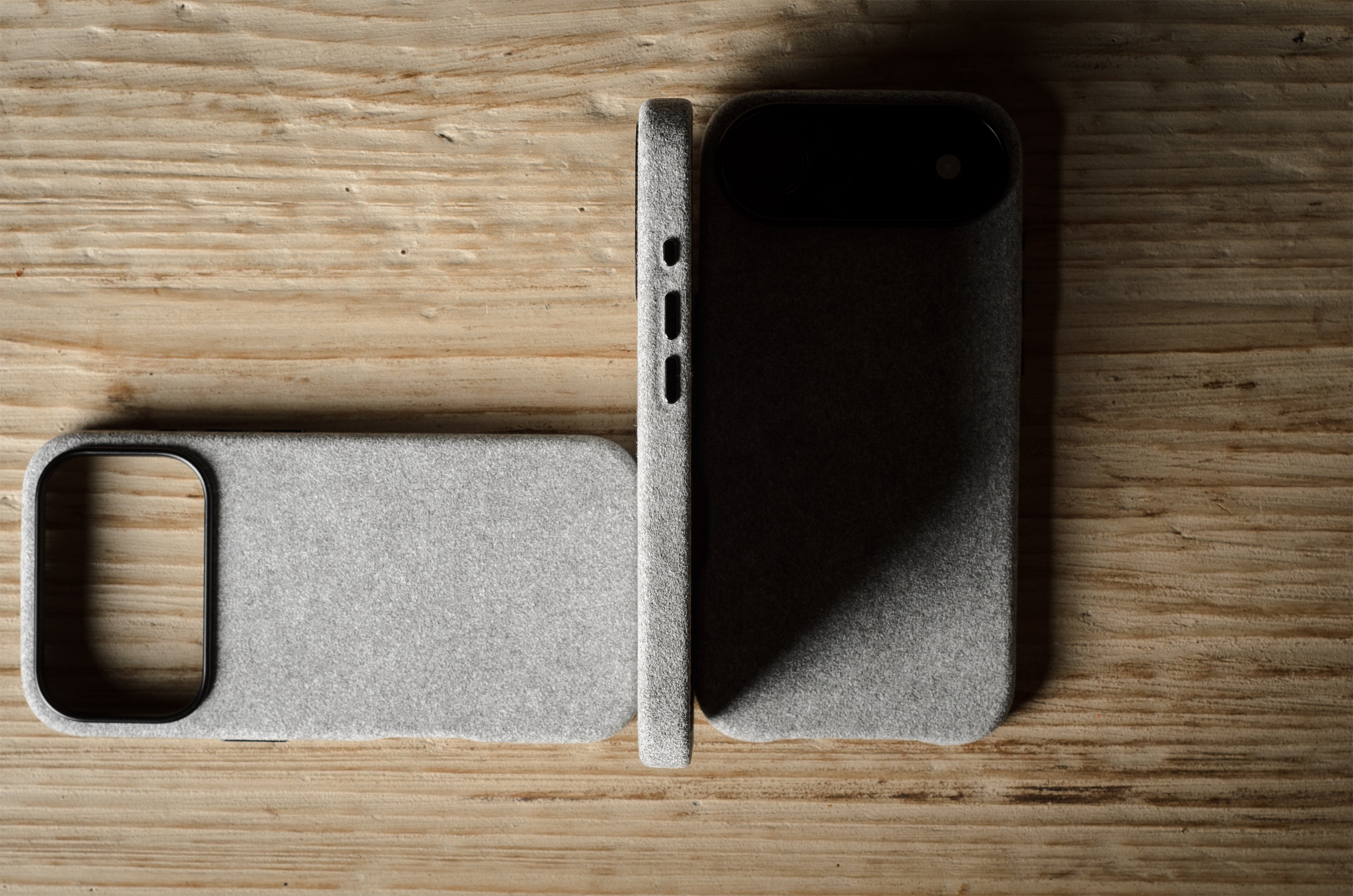 Gray iPhone case on a wooden surface
