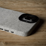 iPhone case with textured surface on a wooden surface