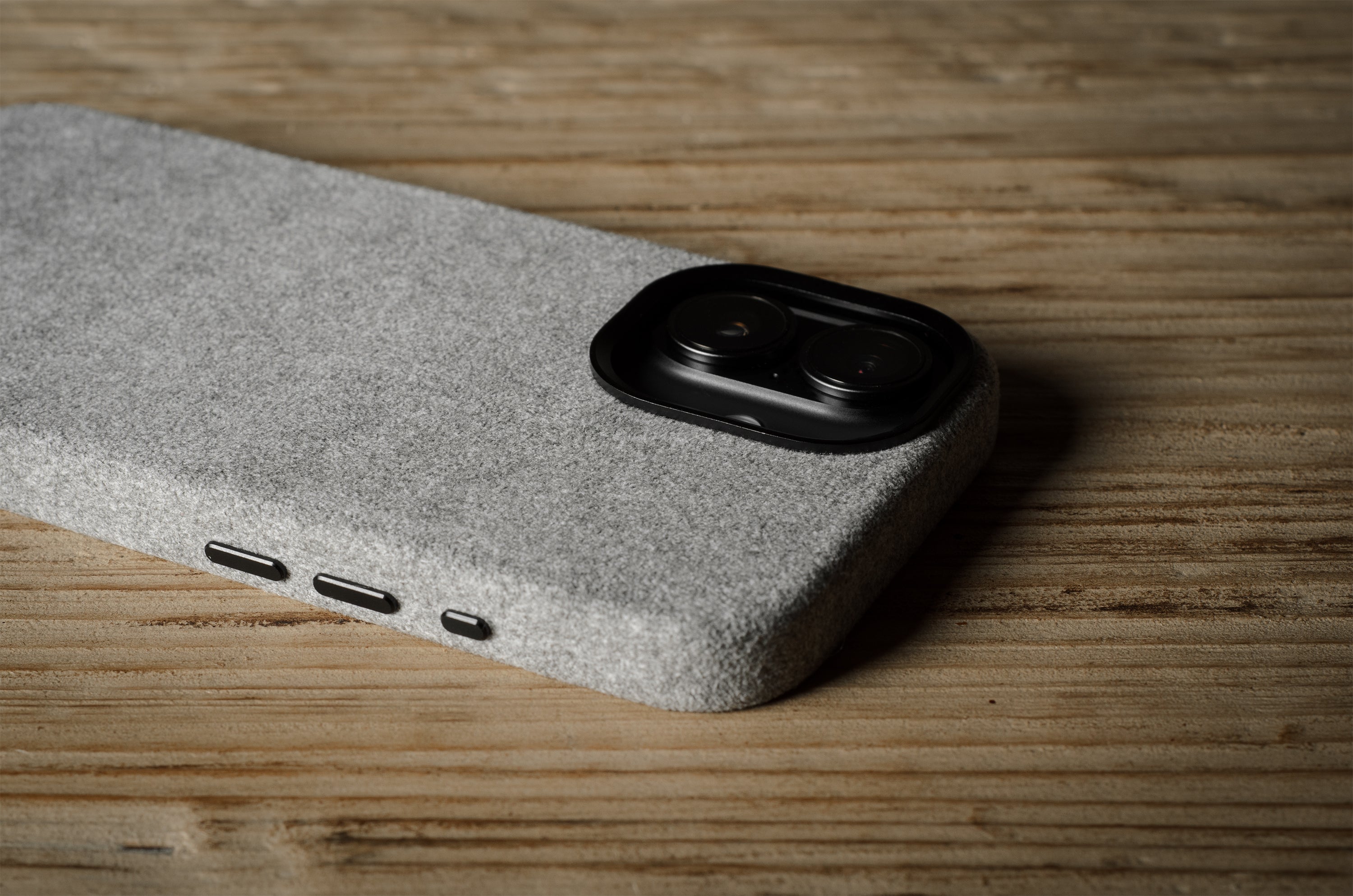 iPhone case with textured surface on a wooden surface