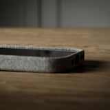 iPhone case with textured surface on a wooden surface