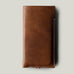 Brown leather phone case on a light gray background