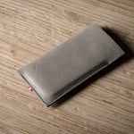Gray iphone case on a wooden surface