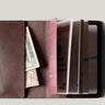 Brown passport Case with passport on light background